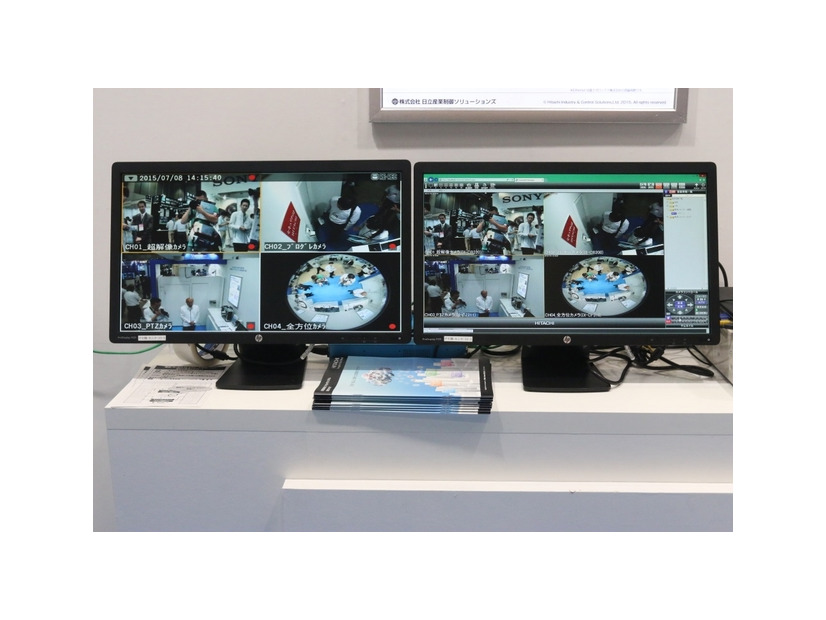 日立産業制御ソリューションズのブースでデモ展示されていた「VisionNet」。左のモニターが圧縮したデータ量で再生した場合の映像、右のモニターが復元して高解像度した際の映像となる（撮影：編集部）